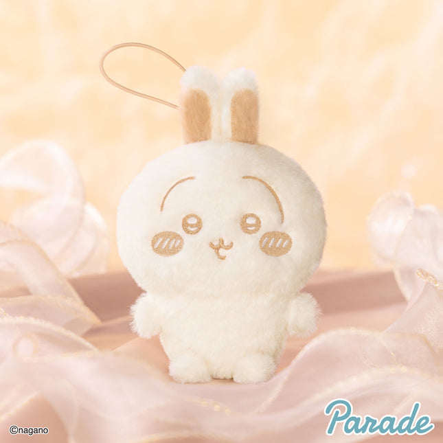 Light cream plush mascot with long ears and stitched face, standing upright