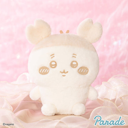 Cream plush rabbit character, seated with stitched smile, whisker marks, and long ears.