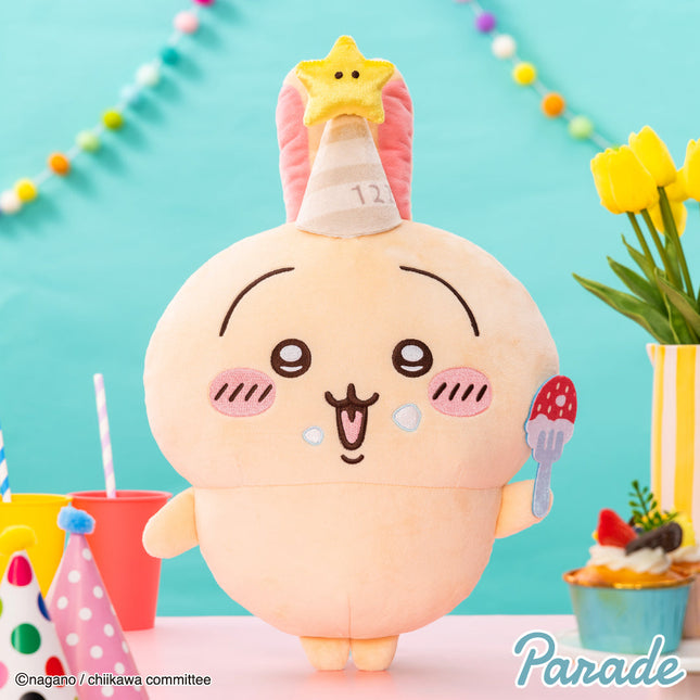 Plush bunny toy with yellow star hat and pink birthday candle, cream body