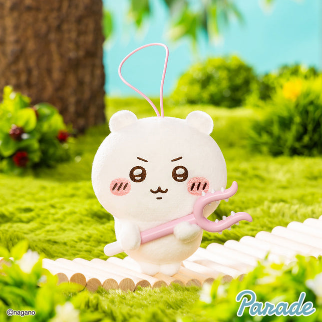 Cream plush mascot keychain holding a pink toy bar, with a dangling string loop