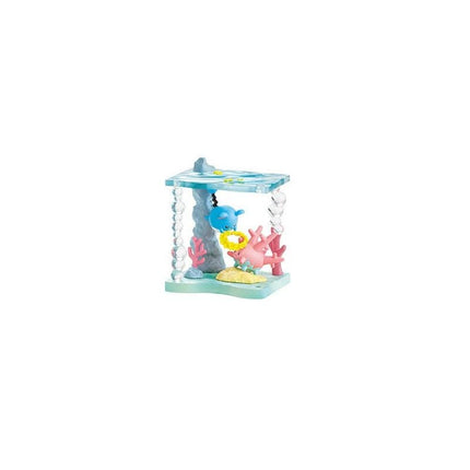 A toy aquarium with a blue base, containing various colorful toy sea creatures such as a blue whale, pink sea anemone, and yellow sea star.