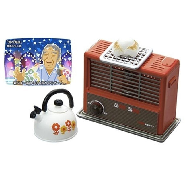a toy tea kettle, a toy radio, and a toy oven, all of which are colorful and decorative.