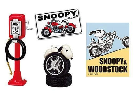 a collection of cartoon-themed items, including a red motorcycle, a Snoopy-themed clock, and a Snoopy-themed gas pump.