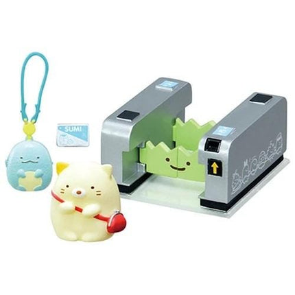 a toy train set with a cat and a blue monster figure. The train set is placed on a platform, and there are two toy figures, one of which is a cat.