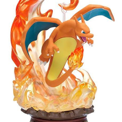 A figurine of a dragon-like creature with orange and yellow colors, surrounded by flames and smoke, mounted on a base.