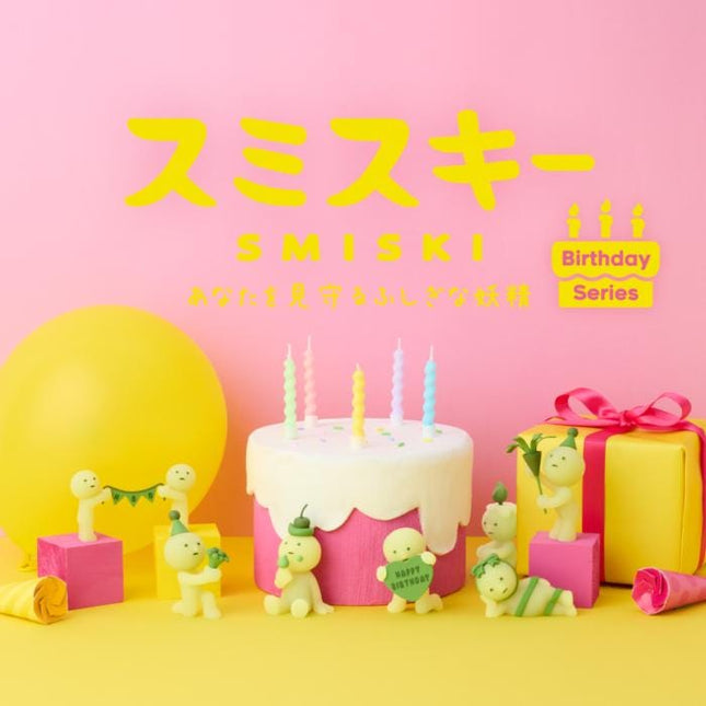The image is a vibrant birthday scene with a cake, balloons, and figurines, all set against a pink background.