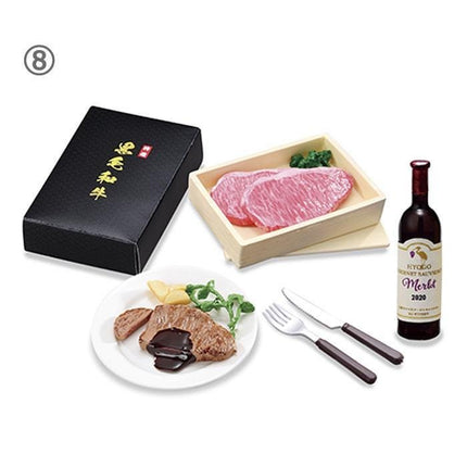 a meal consisting of a plate of meat, a box of meat, a bottle of wine, and a set of silverware.