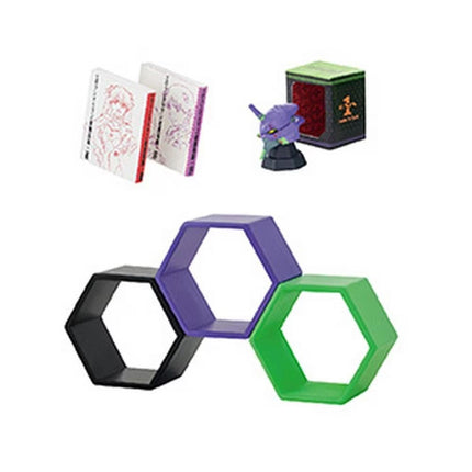 various objects, including books, a toy, and geometric shapes, arranged in a visually interesting manner.
