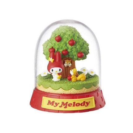 A figurine of My Melody, a character from the My Melody series, is depicted in a glass dome. The figurine is surrounded by various elements, including a tree with apples, a squirrel, and a bird. The figurine is placed on a red base with the word "My Melody" written on it.