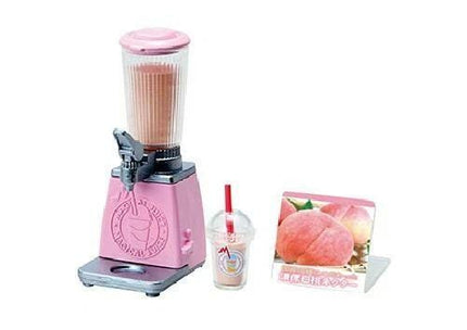 A pink blender with a clear plastic container, a small plastic cup with a straw, and a picture of peaches on a stand.