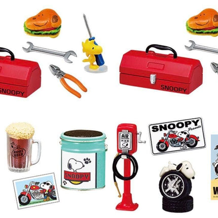 various items related to the character Snoopy, including a red toolbox, a motorcycle, a gas pump, a beer mug, and other miscellaneous objects.