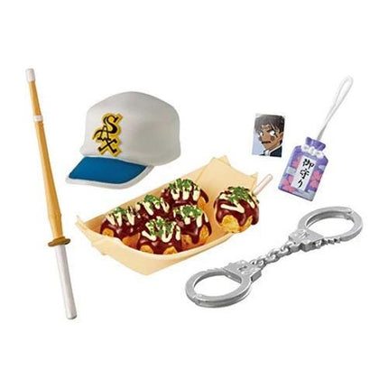 a variety of objects, including a baseball cap, sushi, a pair of handcuffs, and a keychain.