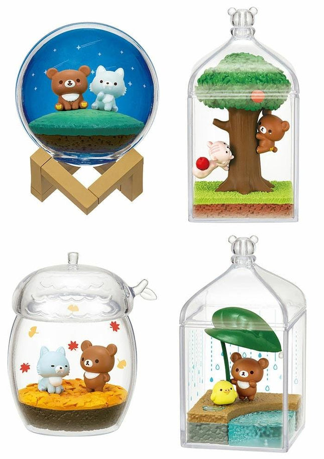 four different miniature figurines or scenes, each displayed in a unique container or setting.