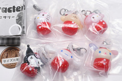 Strawberry-themed character keychain charms in clear capsule packaging with rings