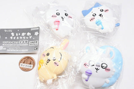 Four Chiikawa light clip toys in clear bags with yellow, white, and blue character figures