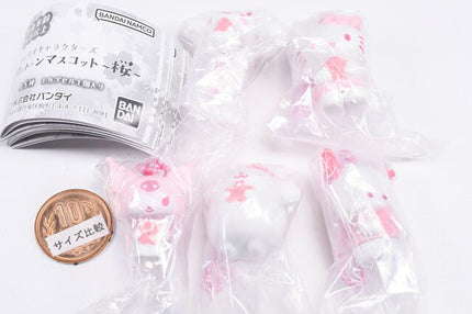 Capsule toy mascot set in clear plastic bag with pink accents and Bandai label