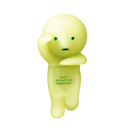 A yellow, glowing figurine with a face and arms, standing upright and holding one hand up to its head.