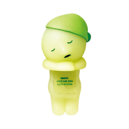 A small, yellow figurine with a green hat and a sign on its chest.