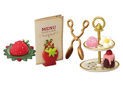 various desserts and utensils, including a strawberry, a menu, a pair of tongs, a cake, and a plate.