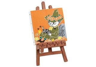 a small wooden easel with a painting of a person wearing a green hat and holding a phone.