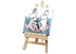 A small wooden easel displaying a painting of two cartoon-like animals, possibly a dog and a cat, sitting on a flower.