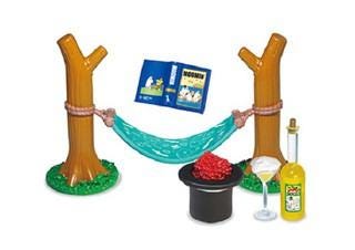 A toy set featuring a hammock, a book, a bottle of wine, and a hat, all set against a white background.