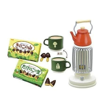 various items, including a green mug, a red kettle, a box of chocolates, and a small toy tea set.