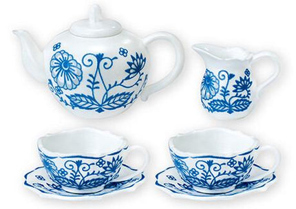 A set of four blue and white porcelain tea cups and saucers, arranged on a white background.