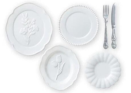 four white plates and two silverware items, including a fork and a knife, arranged on a white background.