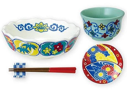 a variety of colorful and intricately designed bowls, plates, and chopsticks, all featuring vibrant floral patterns and designs.