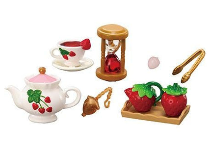 a set of miniature toys including a teapot, strawberry tea set, and a