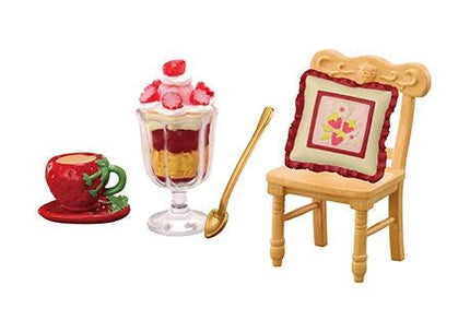 a dessert set consisting of a dessert cup, a dessert glass, and a dessert spoon.