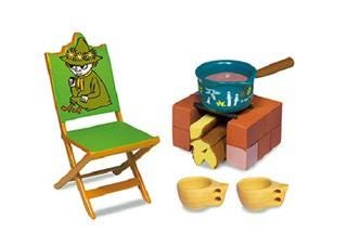 a green folding chair with a cartoon character on the backrest, a blue pot with a handle, and two wooden bowls.