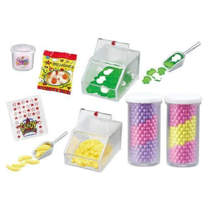 various containers and containers filled with colorful candies, including a clear container with a lid, a clear container with a lid, and two clear containers with lids. There are also two clear containers with lids, one with a lid and one without a lid. Additionally, there is a clear container with a lid and a clear container with a lid, as well as a clear container with a lid and a clear container with a lid.
