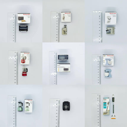 various kitchen appliances and items, including a microwave, toaster, blender, and other kitchen gadgets, all displayed on a white background with a ruler for scale.