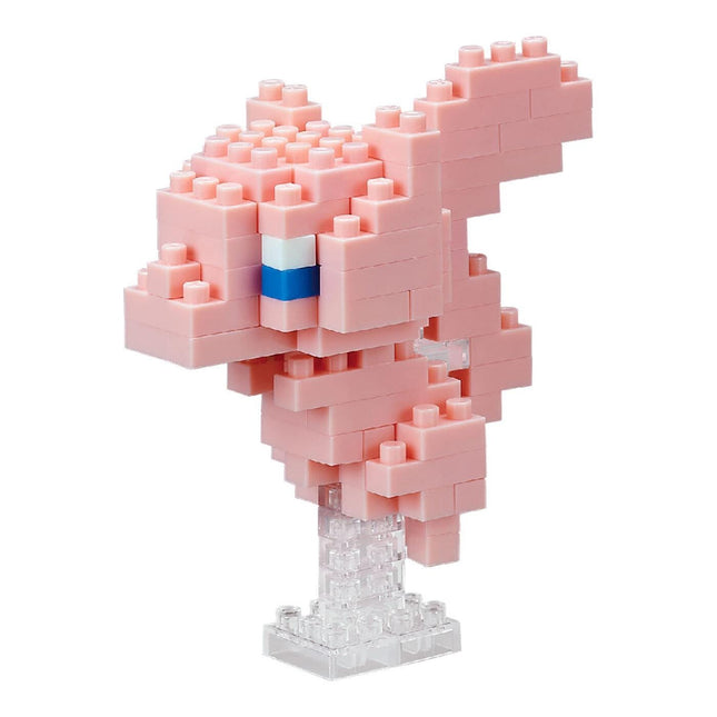 A pink, pixelated figurine made of small, square-shaped blocks, resembling a pixelated character or design.