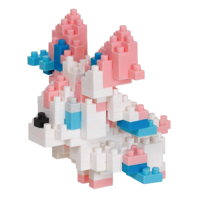 A colorful, three-dimensional toy made of small, interlocking building blocks in various shades of pink, blue, and white.