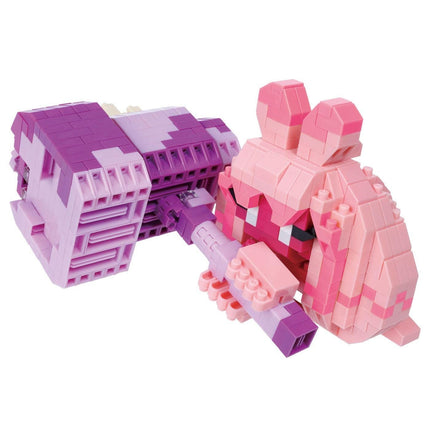 two pink and purple building blocks arranged in a playful manner, with one block holding a purple and pink toy figure.