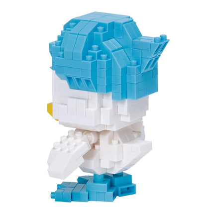 A white and blue Lego bird figurine made up of numerous small Lego bricks.