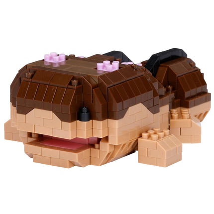 A toy made of small brown and beige building blocks, resembling a small animal or sea creature.
