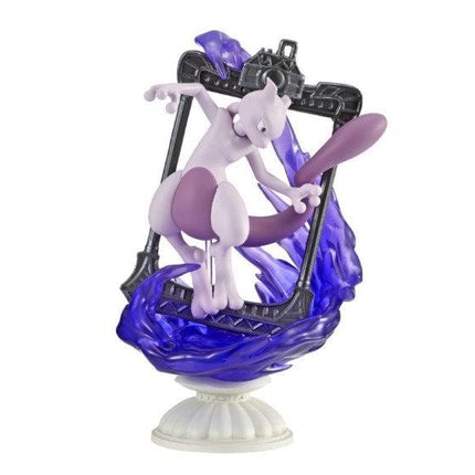 A figurine of a purple cat-like creature with a purple tail, standing on a pedestal and holding a purple object.