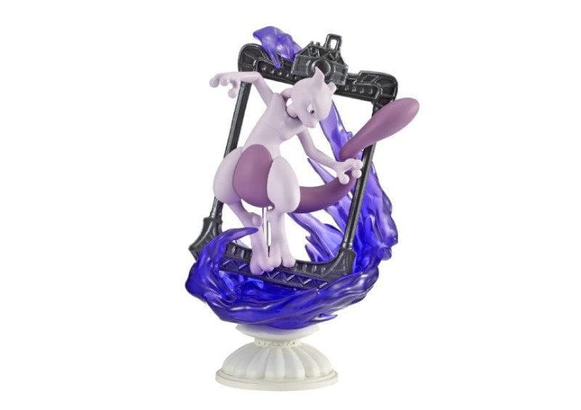 A figurine of a purple cat-like creature with a purple tail, standing on a pedestal and holding a purple object.