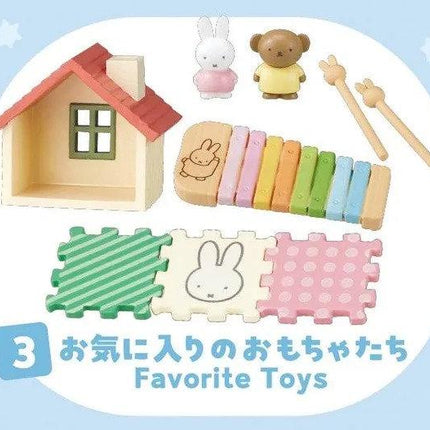 various toys and items, including a small house, a teddy bear, a xylophone, and a bunny. The text "Favorite Toys" is written in the bottom right corner, and there are also some Japanese characters present.