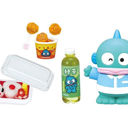 various colorful toys and food items, including a blue toy fish, a toy cup, a toy noodle, a toy soda bottle, and a toy container with a red and white clown face.