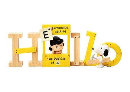 a wooden sign with the word "Hello" made up of wooden letters, along with a small figure of a dog and a person inside the sign.