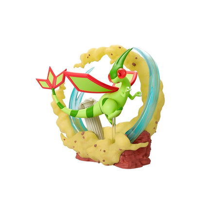 A green and red dragon figurine is depicted in a dynamic pose, surrounded by a colorful explosion-like effect.