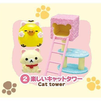 A cat tower with a yellow duck and a pink bear, along with paw prints, is featured in the image.