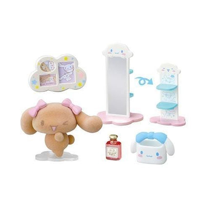 a variety of cute and colorful toys, including a doll, a mirror, a bottle, and a small white container with a blue bow.