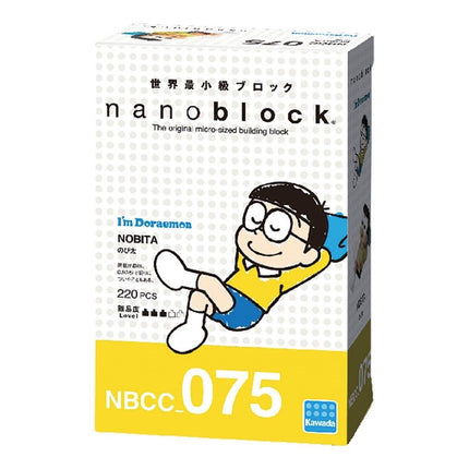The image is a box containing a product called "Nobita" from the Doraemon series. The box is yellow and white, with a cartoon image of a boy wearing glasses and a yellow shirt. The box also has text in Japanese and English, indicating that it is a micro-sized building block.