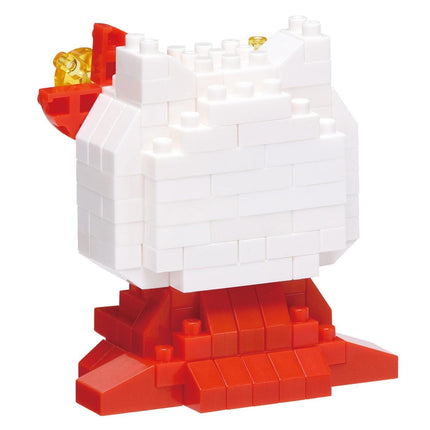 A red and white toy castle made of white and red building blocks.